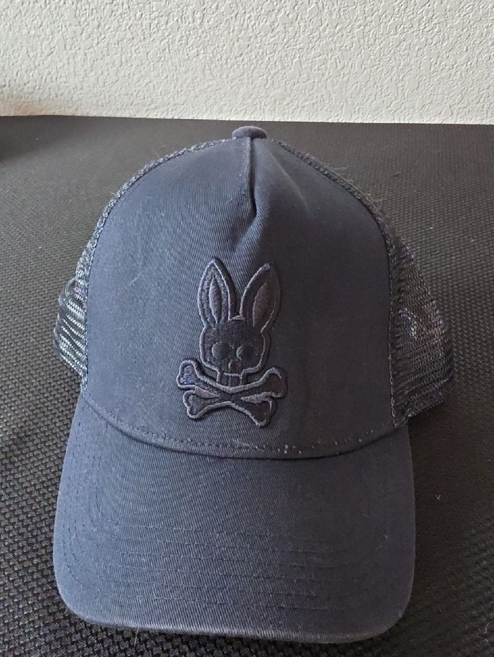 Psycho Bunny black mesh trucker cap with embroidered bunny